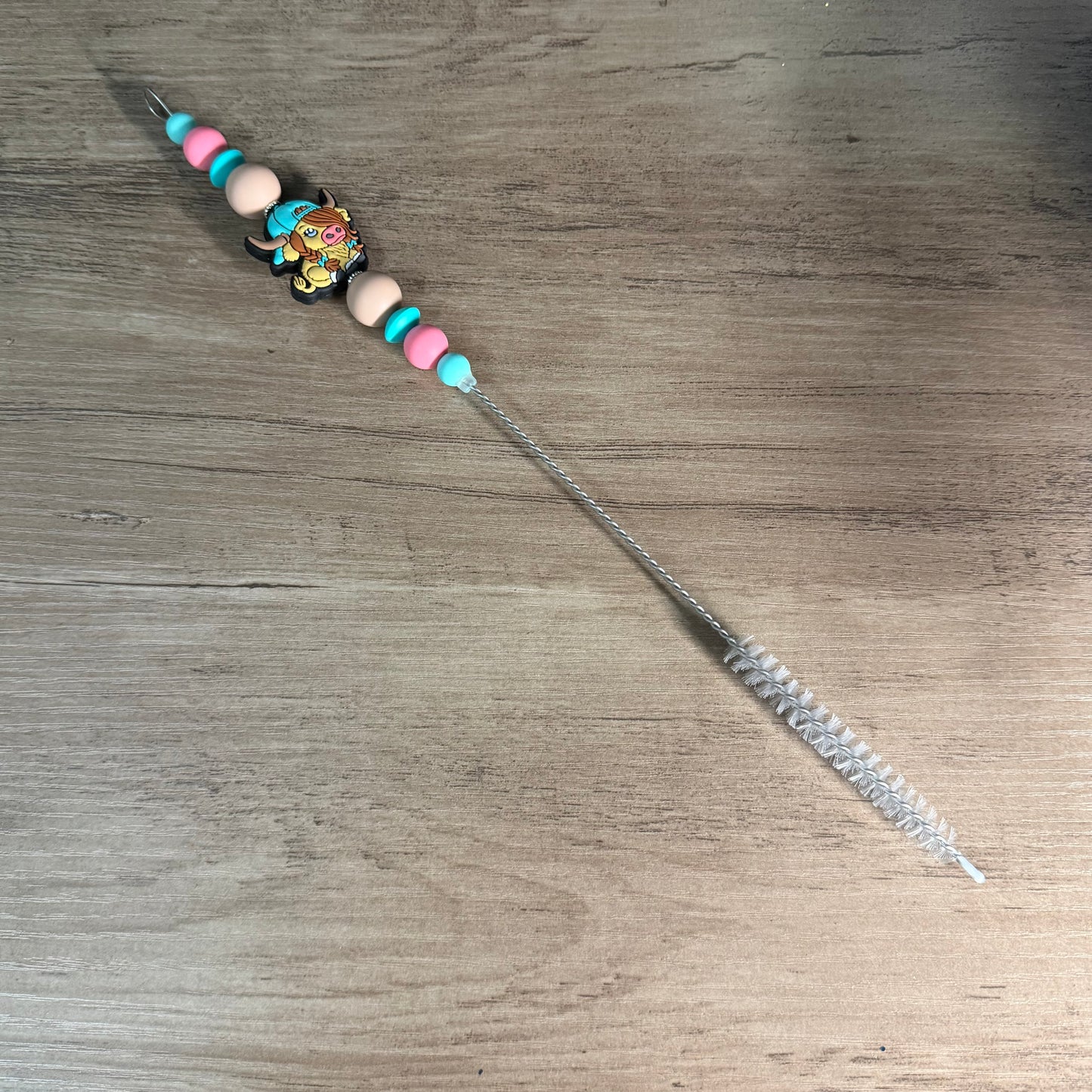 Beaded straw cleaner
