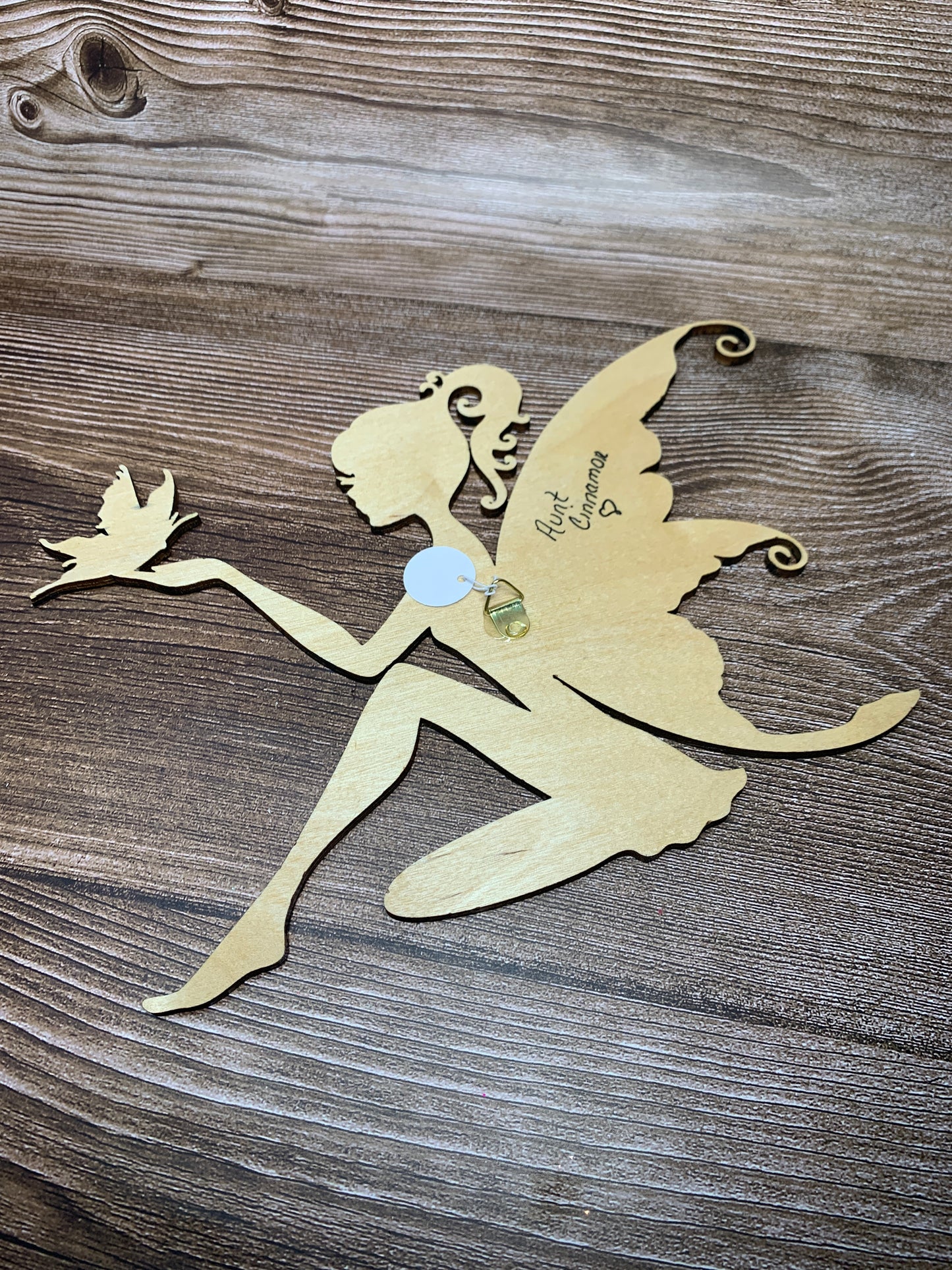 Fairy with a butterfly wall hanging