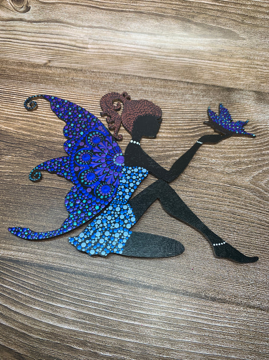 Fairy with a butterfly wall hanging