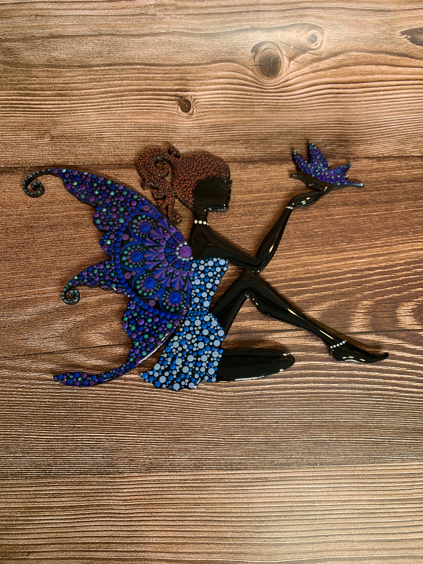 Fairy with a butterfly wall hanging